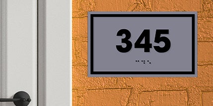 Gray ADA Room Sign With The Number 345 In Black With The Corresponding Braille Below