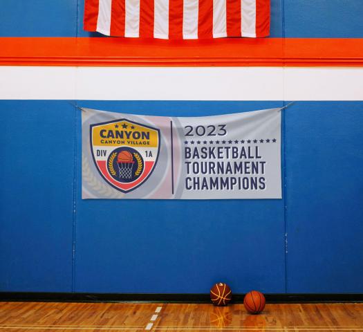 Sports banner hanging in a gym class.