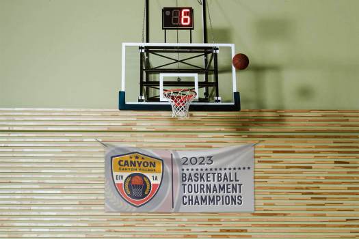 Sports banner hanging below a basketball hoop