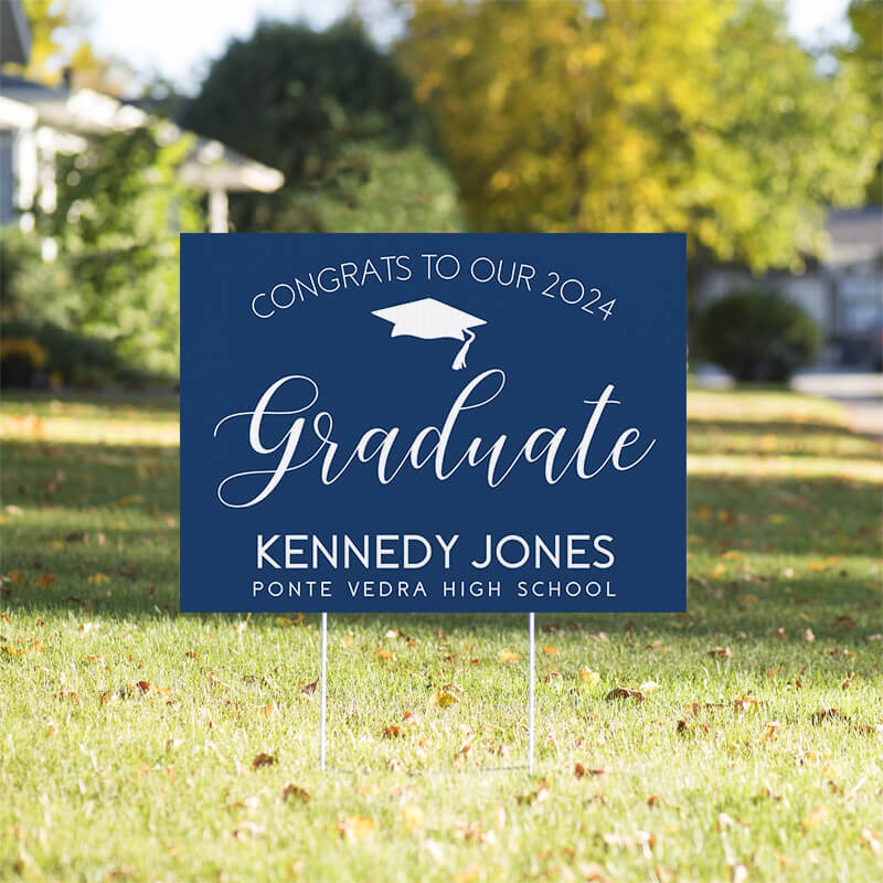 Congrats to our graduate yard sign displayed in a sunny yard