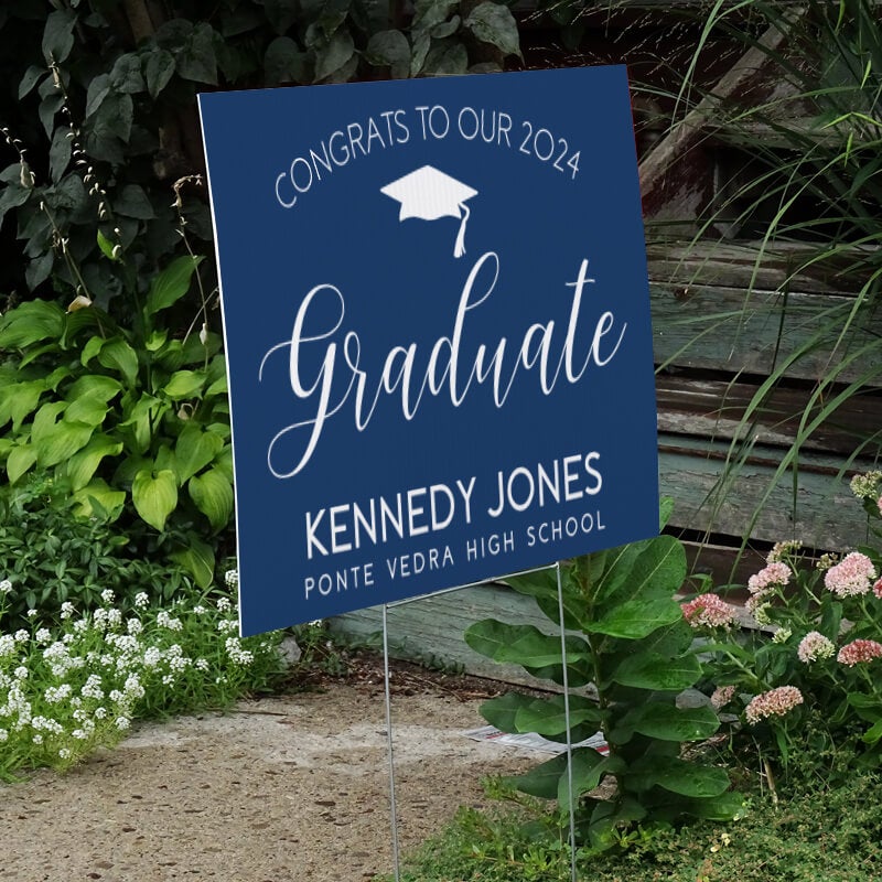 Congrats to our graduate yard sign displayed next to stairs