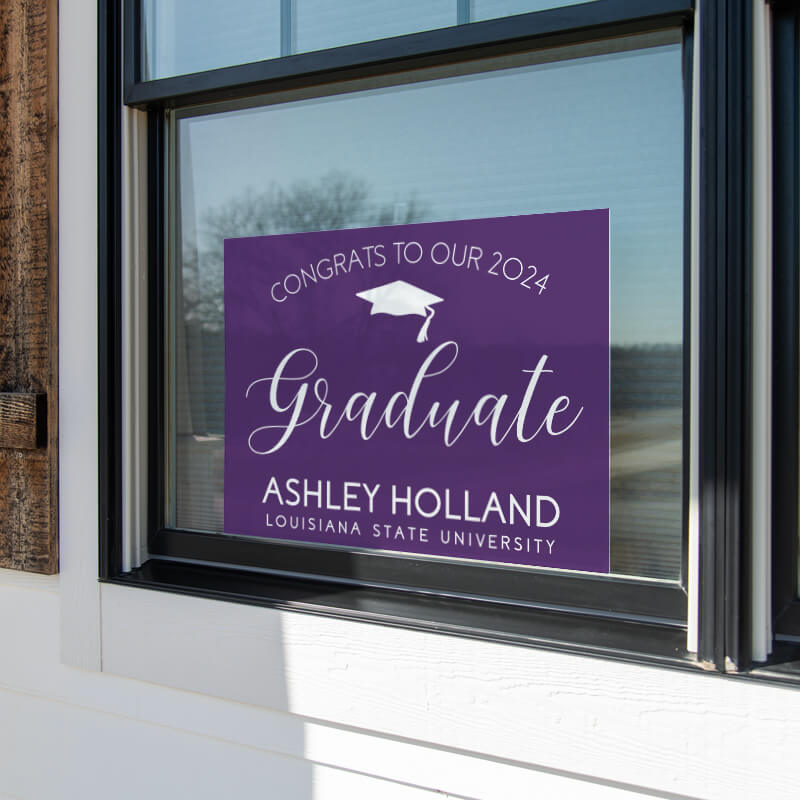 Congrats to our graduate yard sign displayed in window