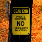 Dead End Private Property No Trespassing or Soliciting Sign on Tree