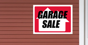 garage sale sign on wall