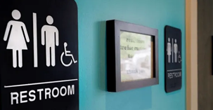 restroom signs on wall